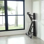 MABR1 Multi-Adjustable BENCH von Matrix Fitness stored against wall front angle